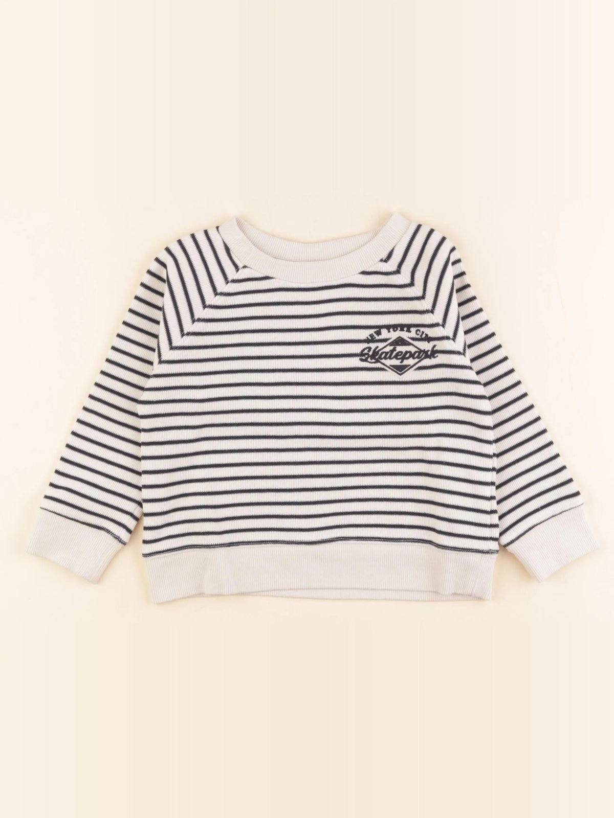 Pull beige, bleu